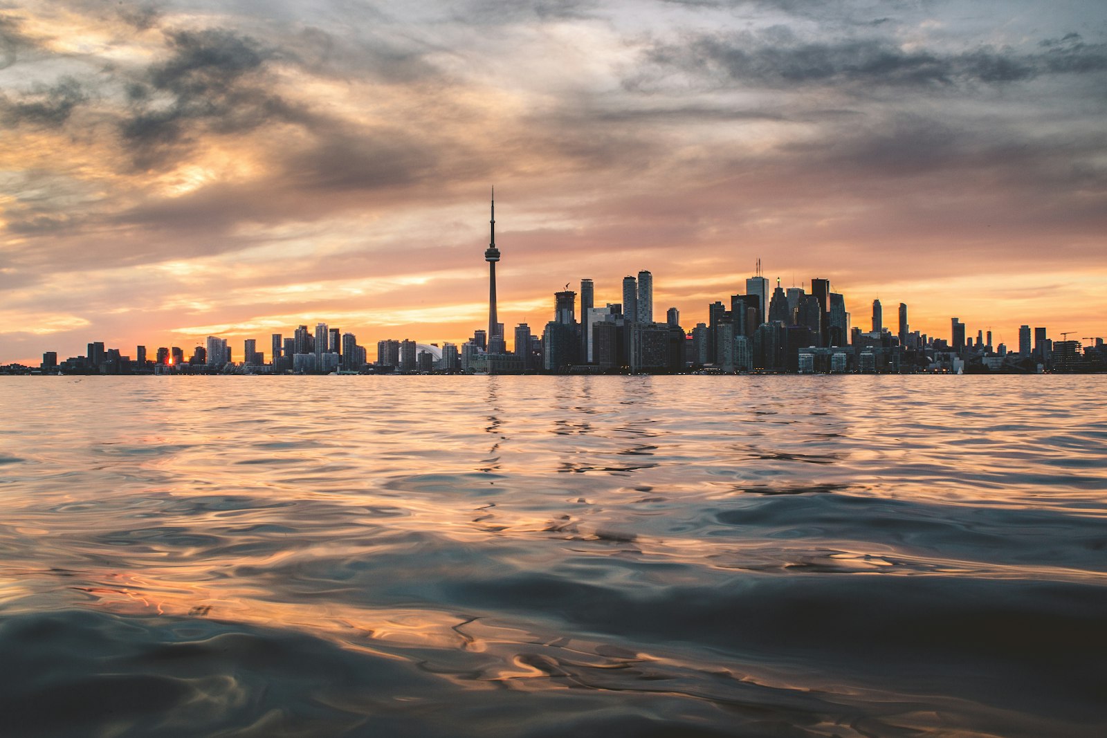 Toronto skyline and CN Tower at sunset representing the GTA real estate and mortgage market