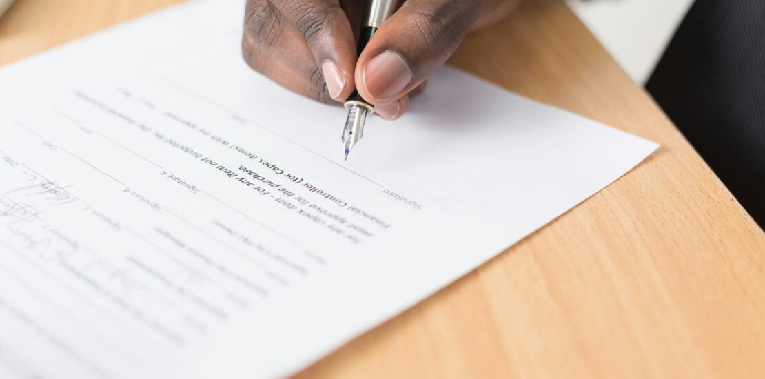 Homeowner signing a mortgage renewal contract in the GTA